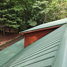 OUR-METAL-ROOF-CLEANING-SERVICE-RESTORED-THIS-ROOF-IN-DAHLONEGA-GA 4